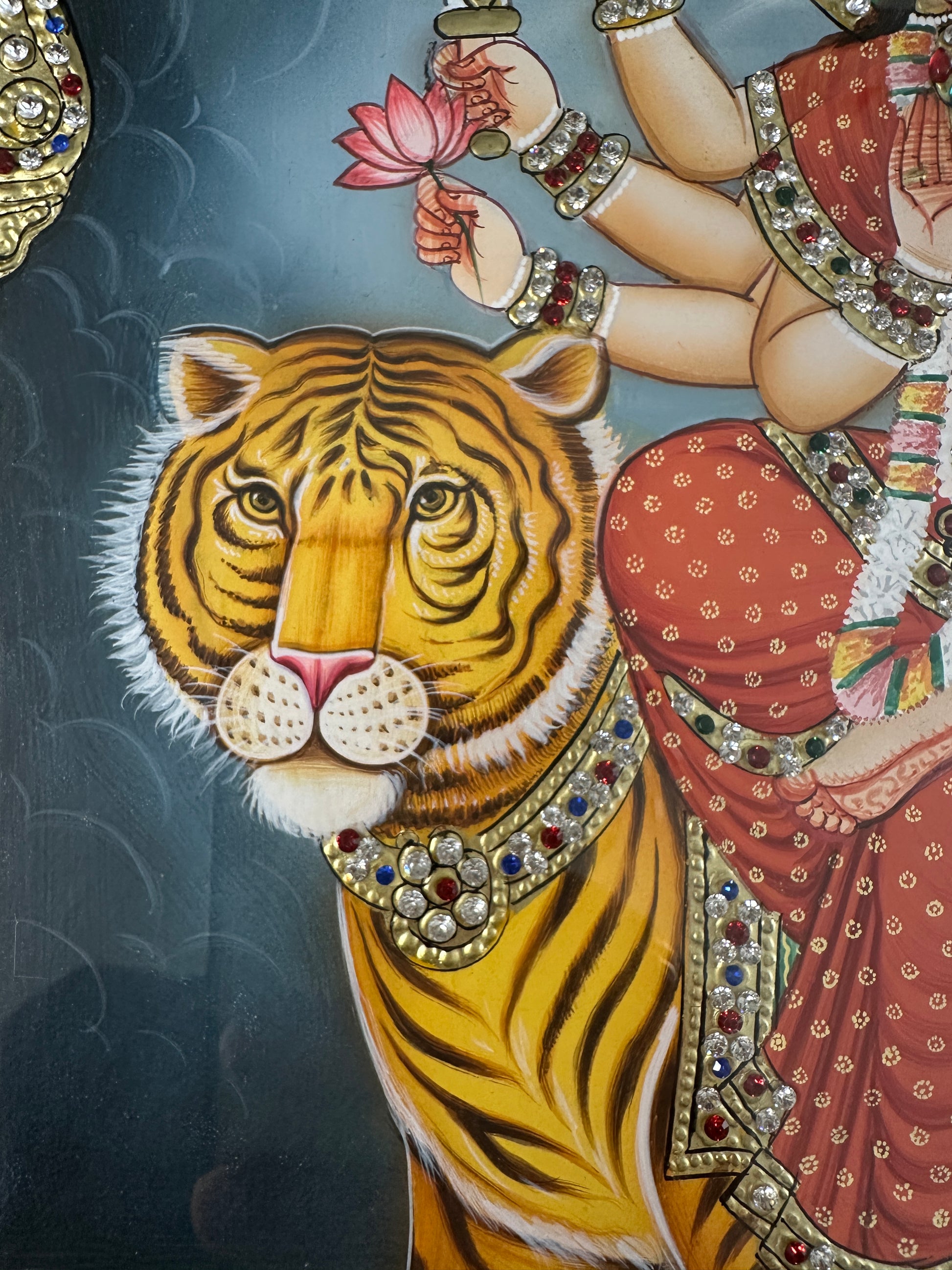 Close-up of Ambe Maa artwork with Swarovski crystal embellishments