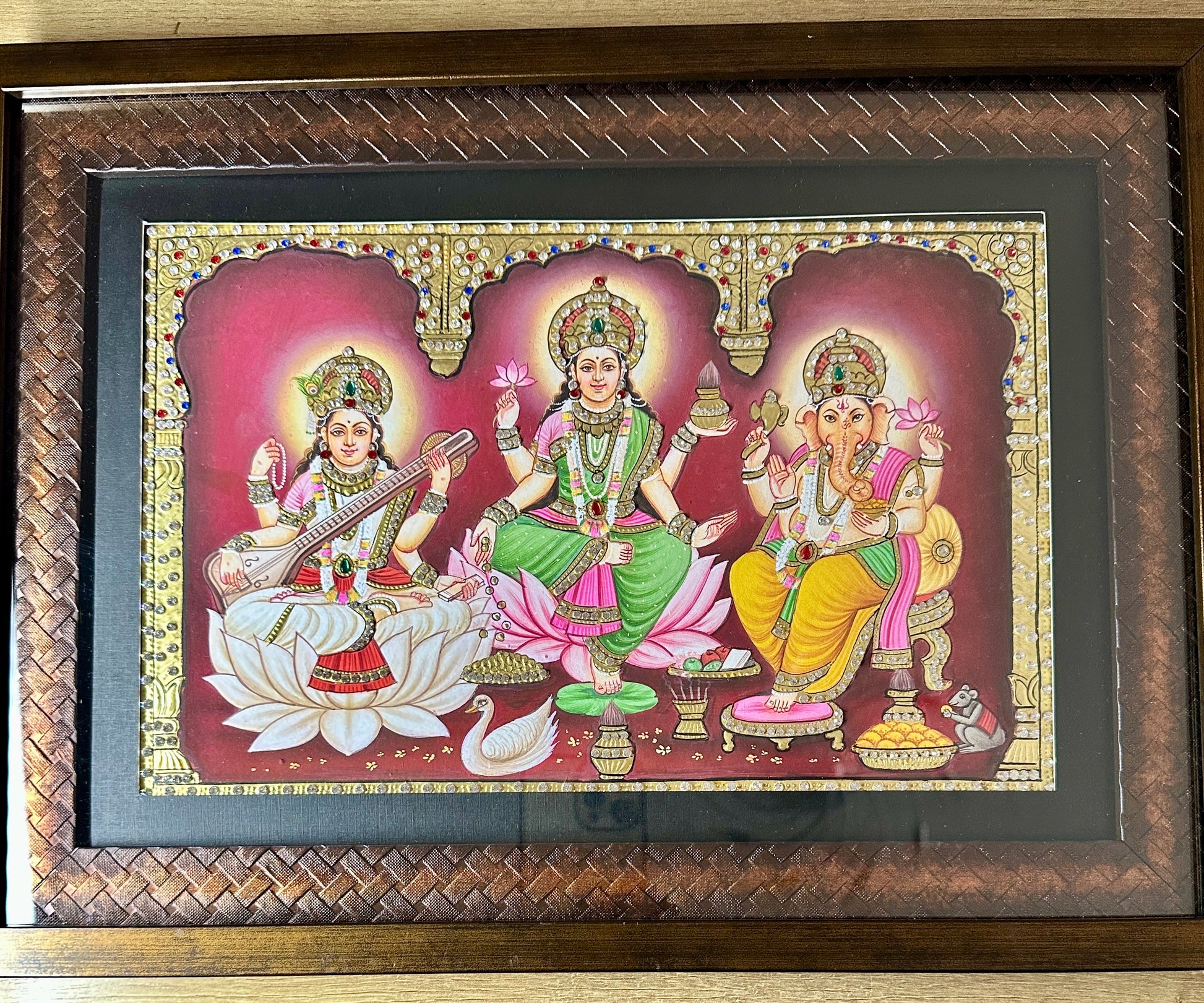 Close-up of Lakshmi Saraswati Ganesh artwork showing 24kt gold leaf detailing