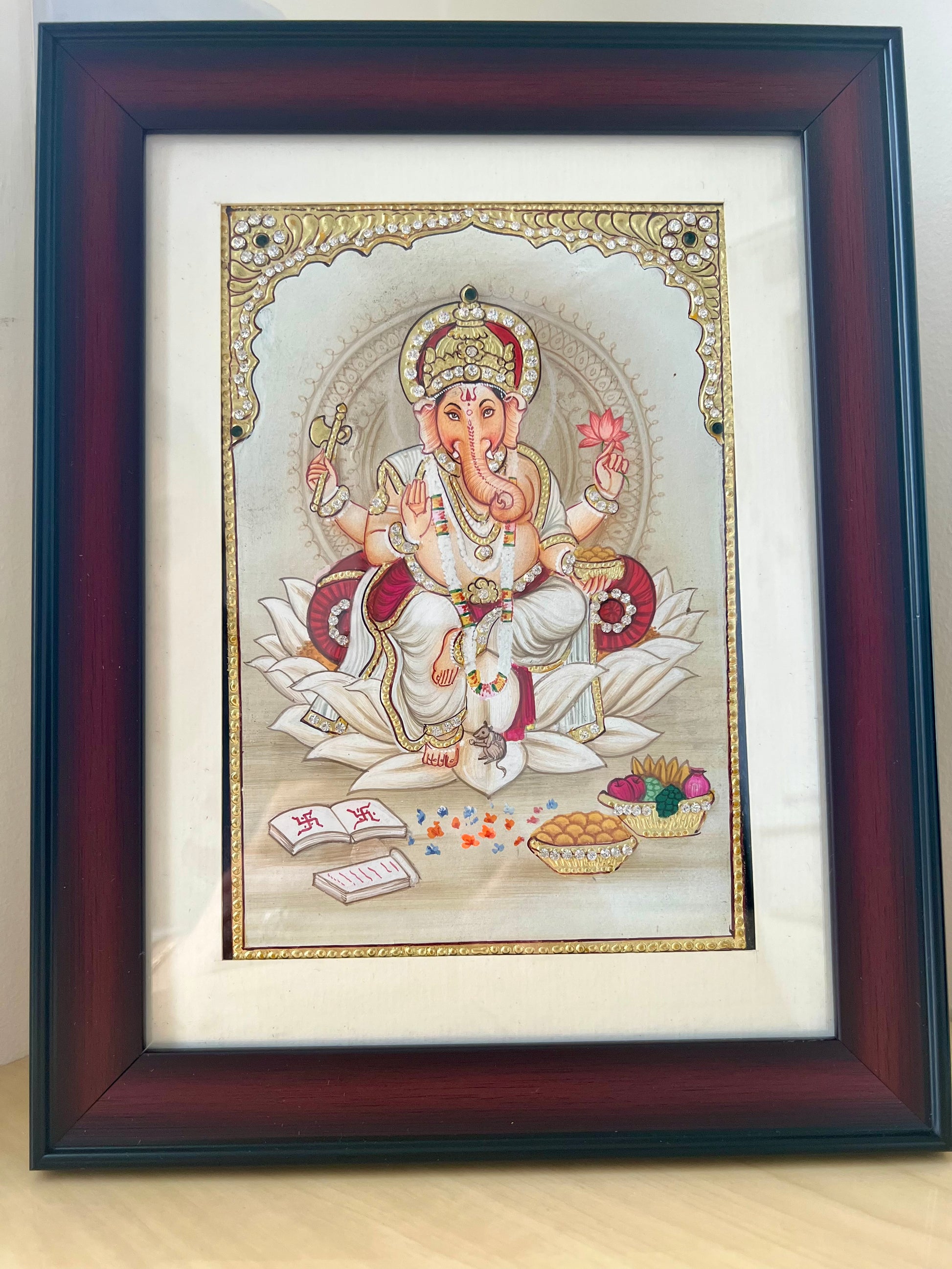 Handpainted Ganpati Bappa (Ganesha) artwork with 24kt gold foil and Swarovski crystal detailing, framed devotional painting