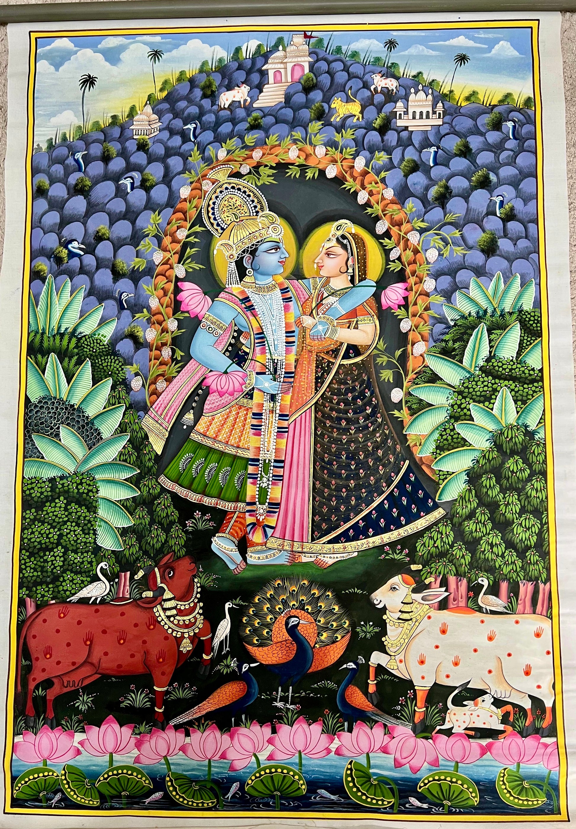 Handpainted Radha-Krishna Pichwai artwork with Govardhan Parvat and 24kt gold leaf on cotton canvas