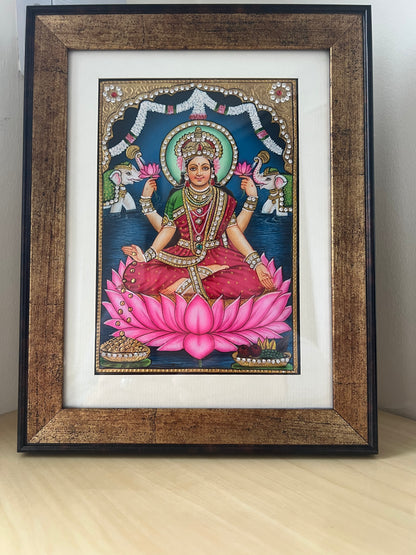 Close-up of Maa Lakshmi painting showing gold foil detailing and intricate handpainted finish
