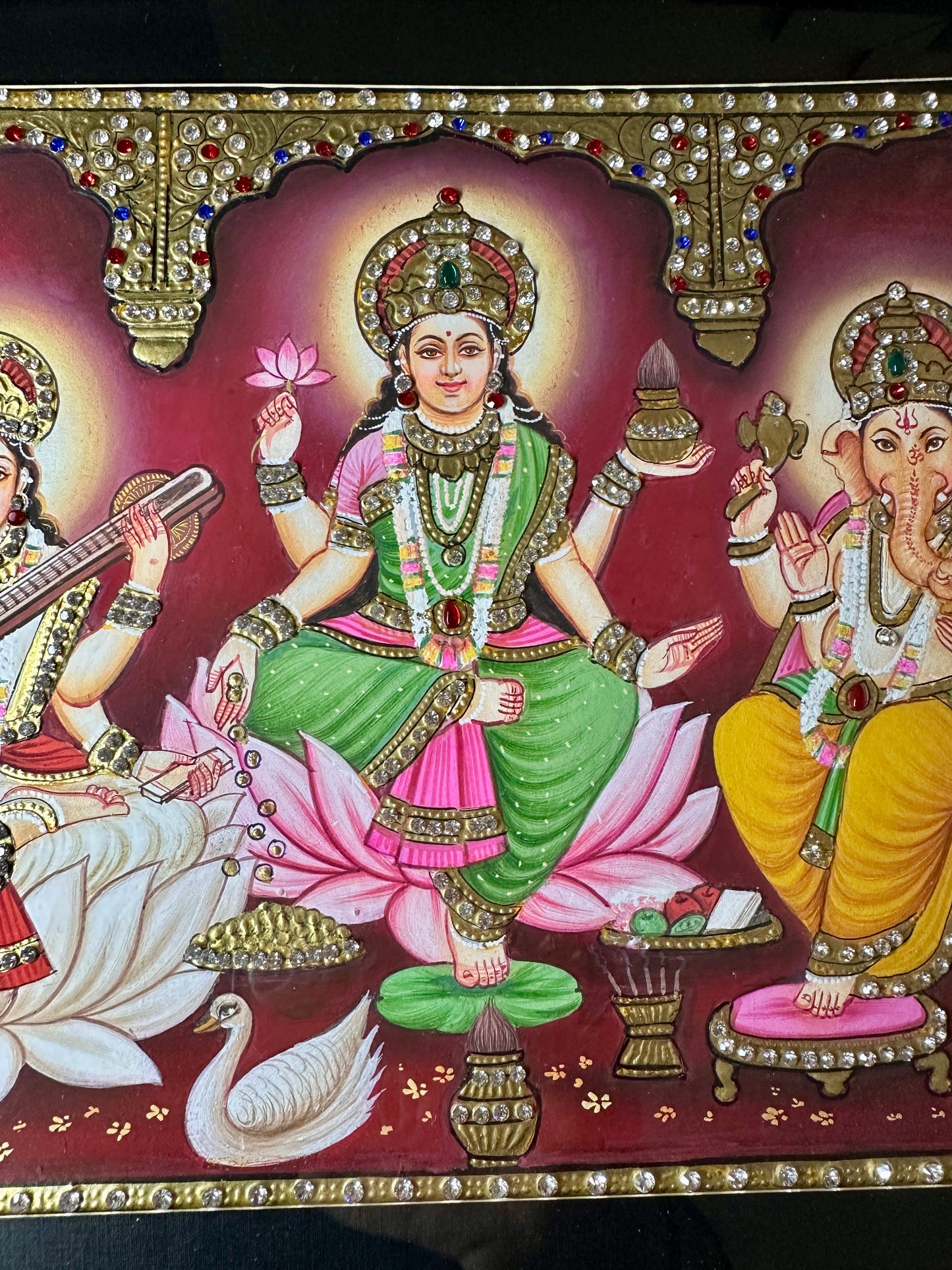 Close-up of Lakshmi Saraswati Ganesh artwork with Swarovski crystal embellishments