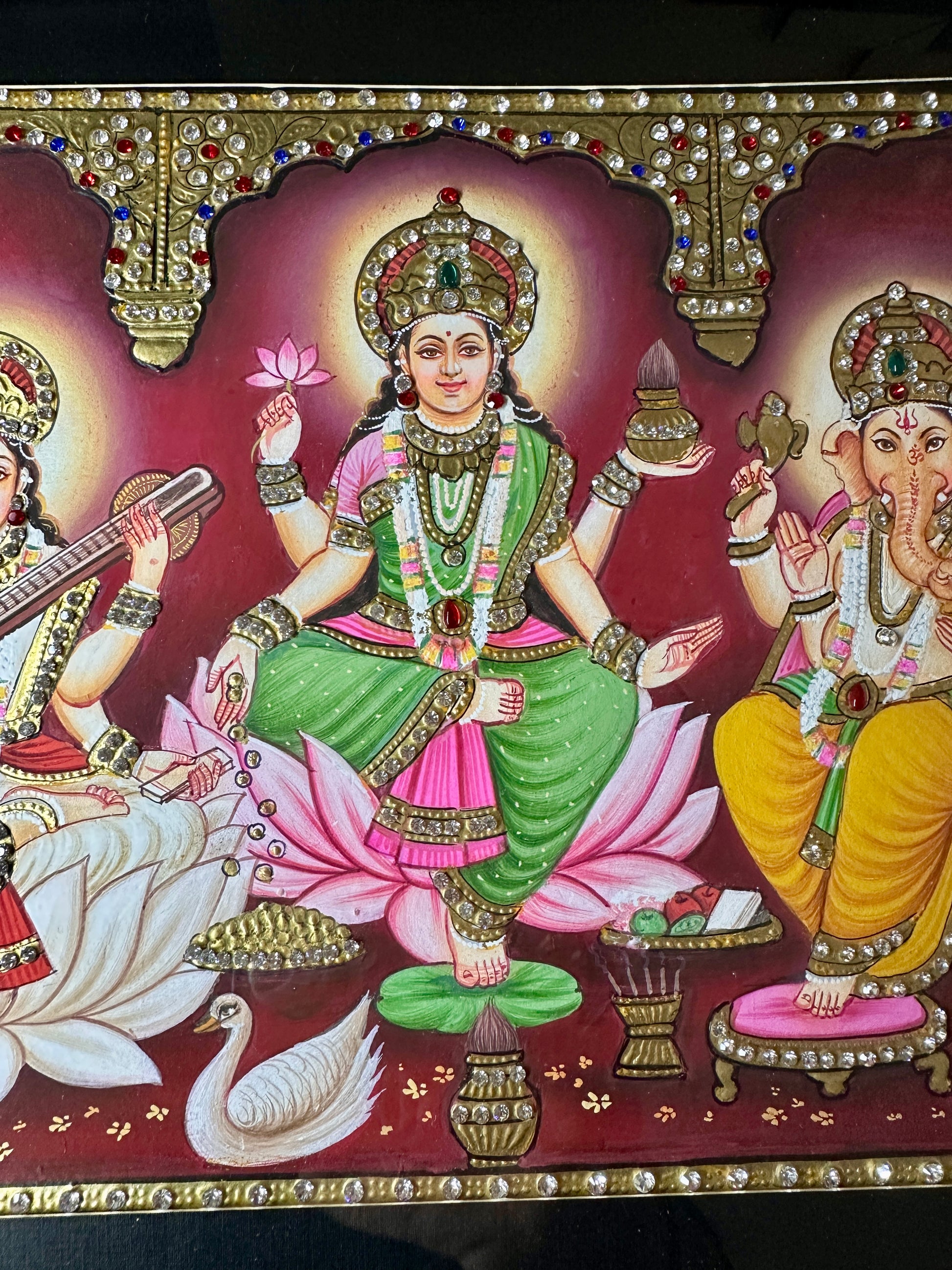 Close-up of Lakshmi Saraswati Ganesh artwork with Swarovski crystal embellishments