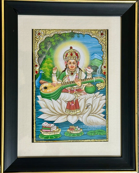 Handpainted Maa Saraswati artwork with 24kt gold foil and Swarovski crystal detailing, framed devotional painting