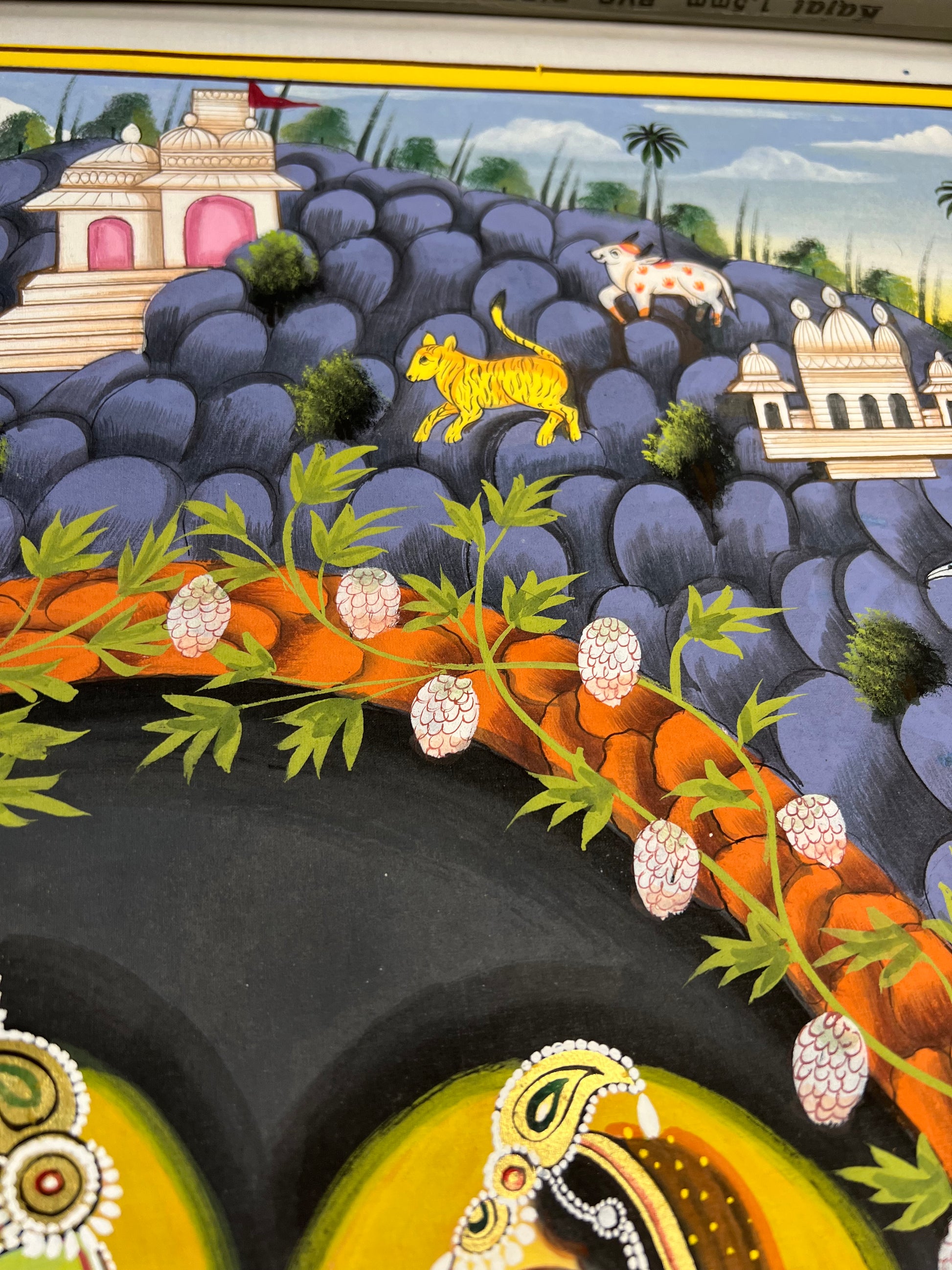 Close-up of Radha-Krishna Pichwai artwork showing gold leaf detailing and fine handpainting