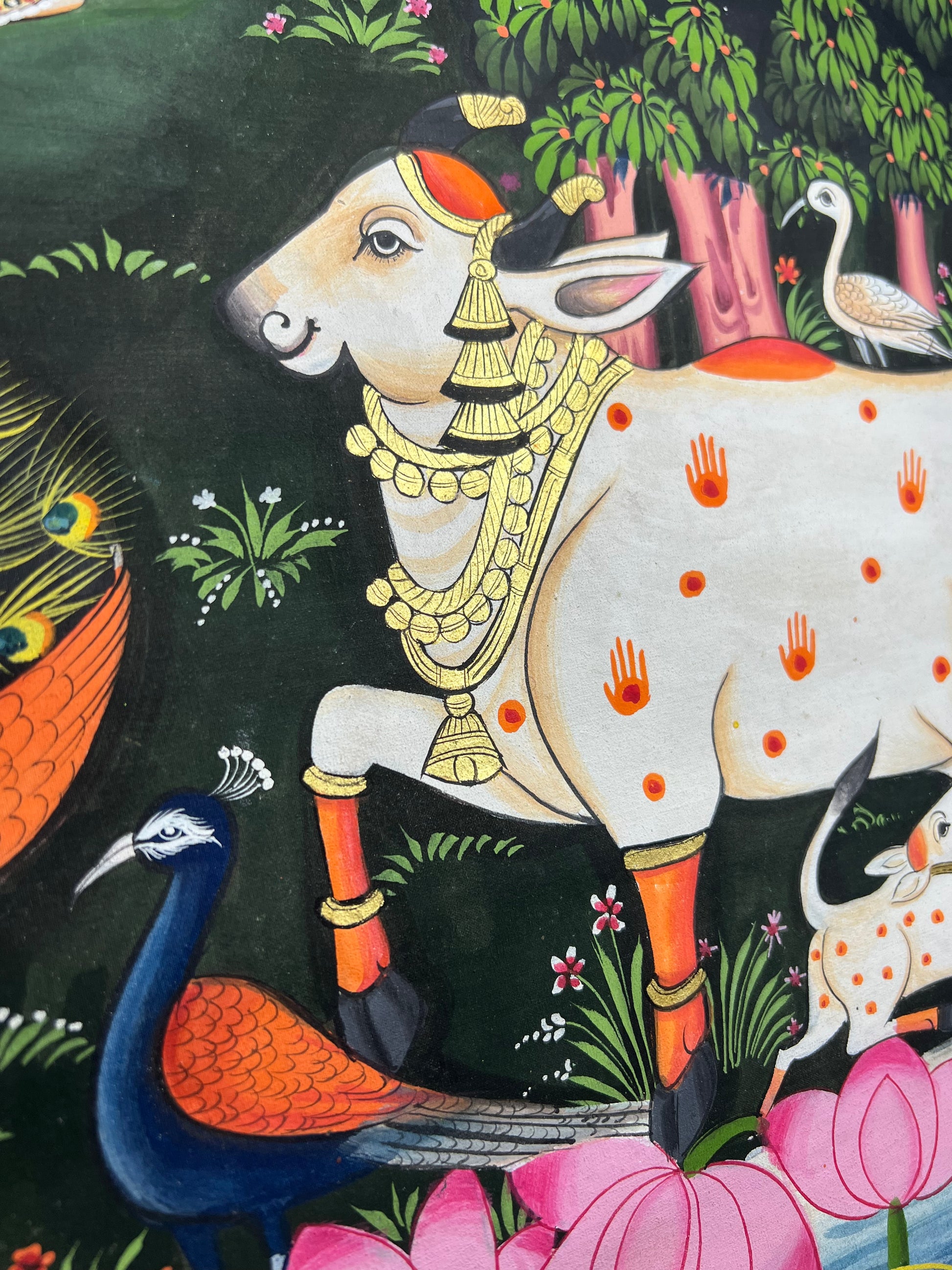 Close-up of Radha-Krishna Pichwai artwork showing gold leaf detailing and fine handpainting