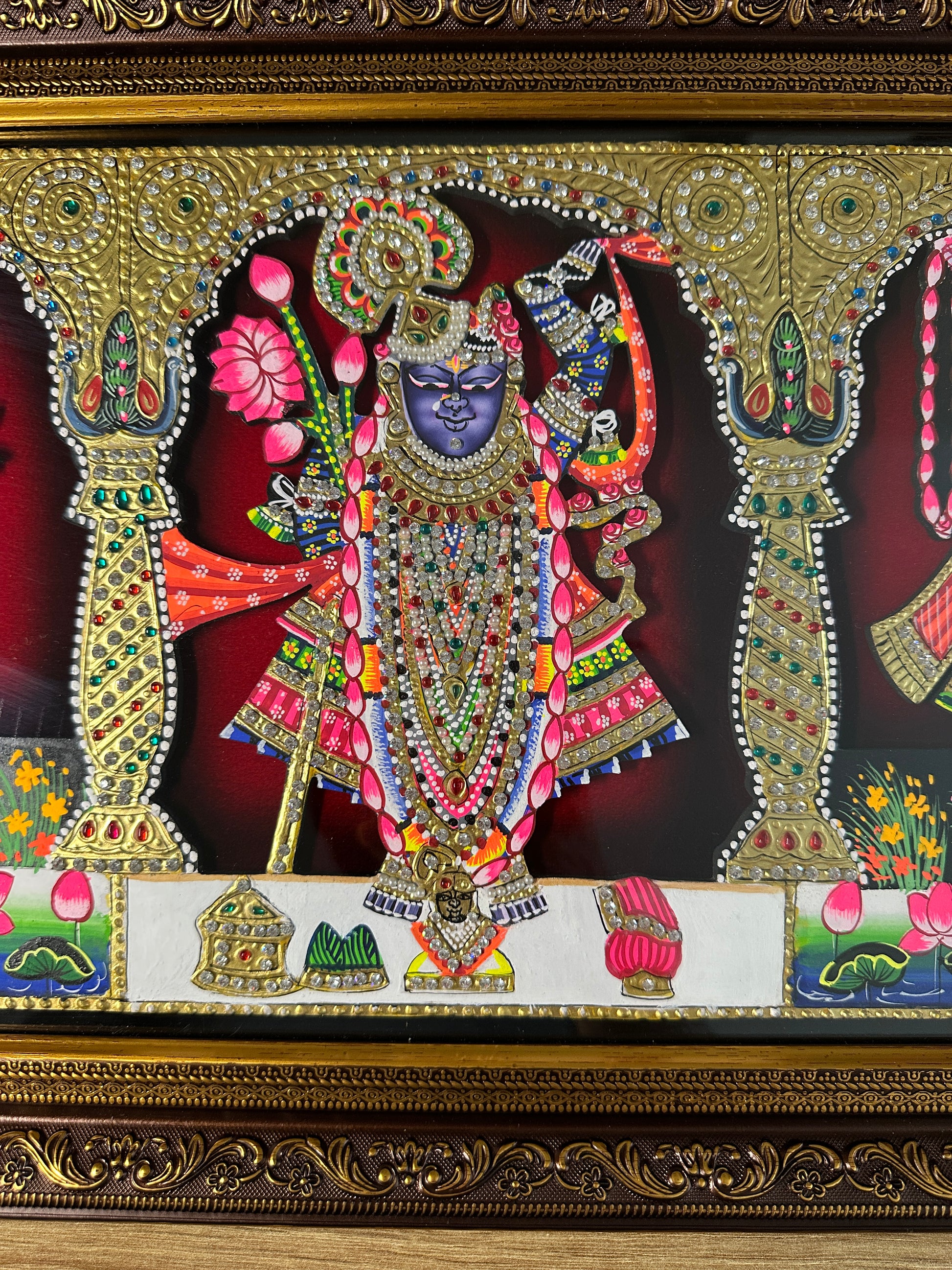 Close-up of raised wooden artwork with Swarovski crystal embellishments