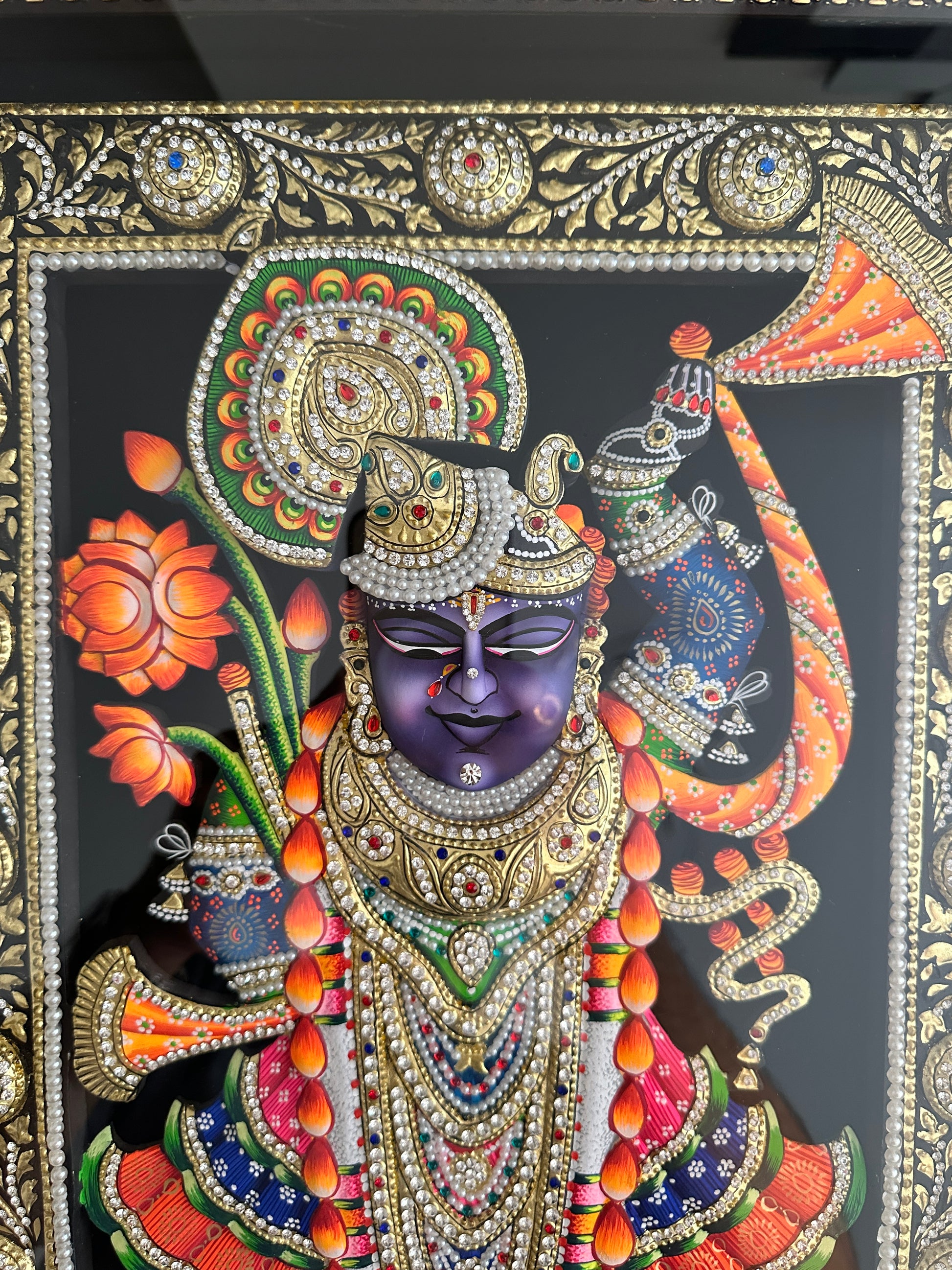 Close-up of Shreenathji artwork showing 24ct gold leaf detailing