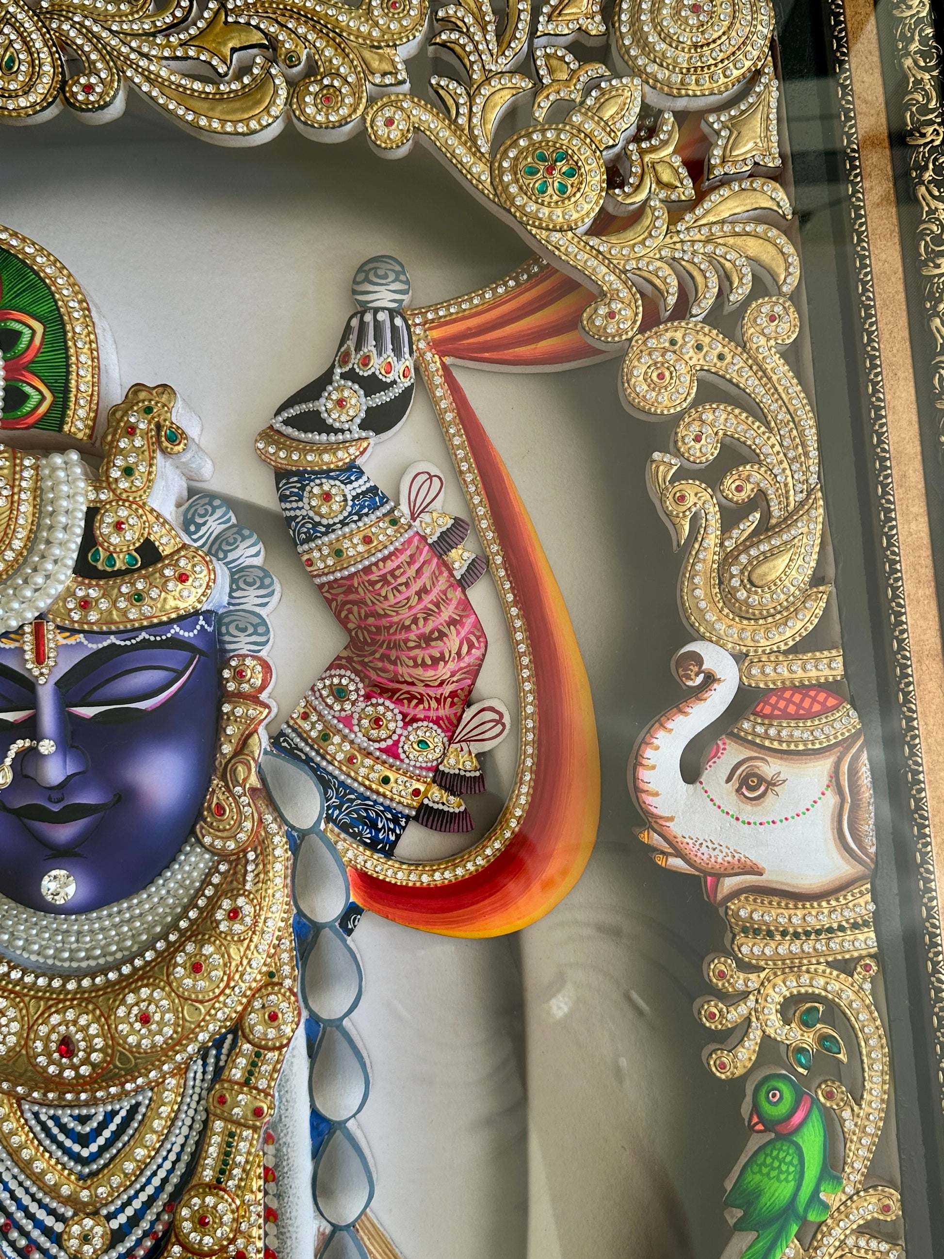 Close-up of Shreenathji artwork with Swarovski crystal embellishments