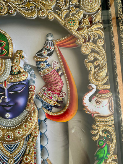 Close-up of Shreenathji artwork with Swarovski crystal embellishments