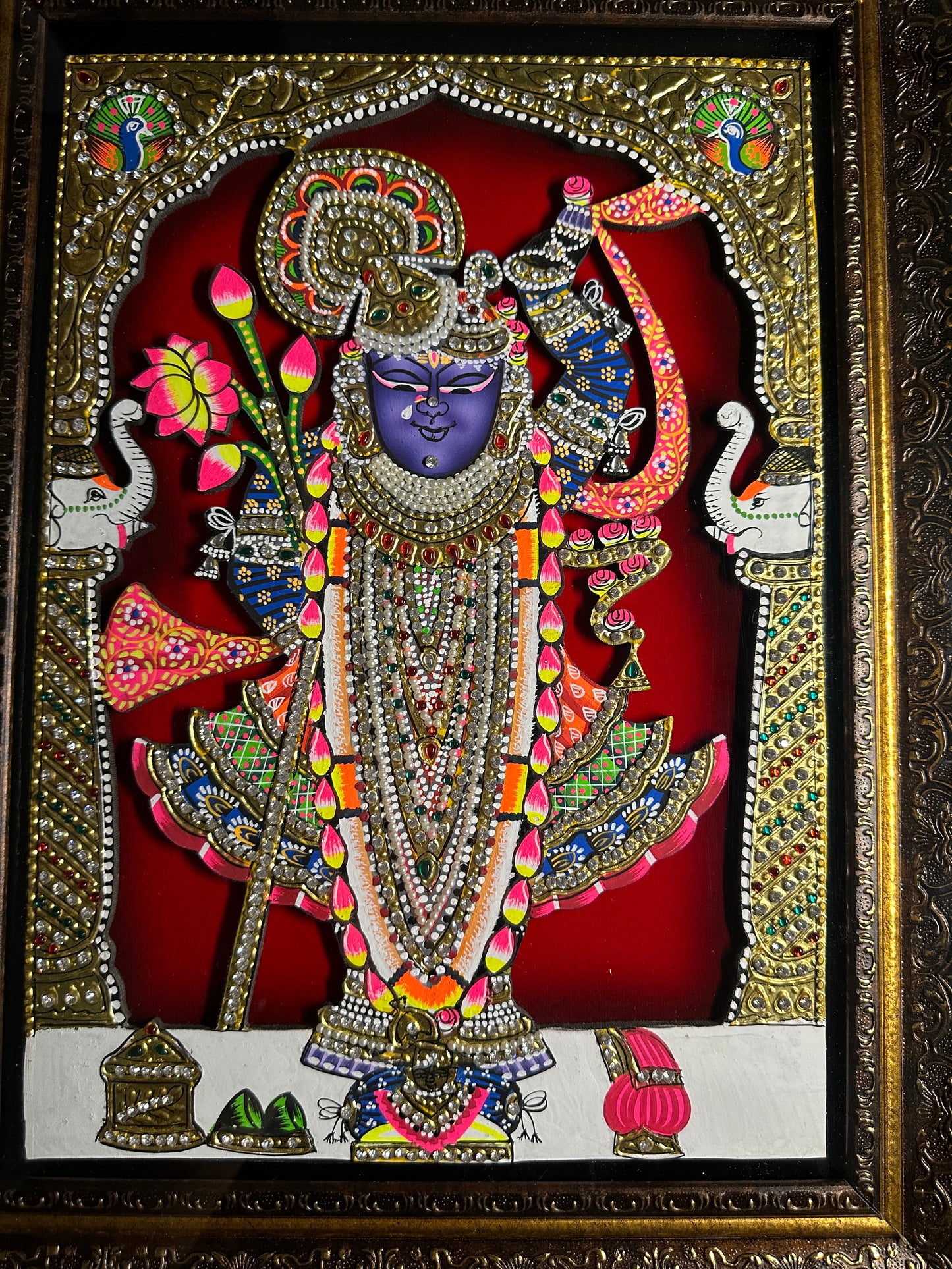 Close-up of Shreenathji artwork with Swarovski crystal embellishments