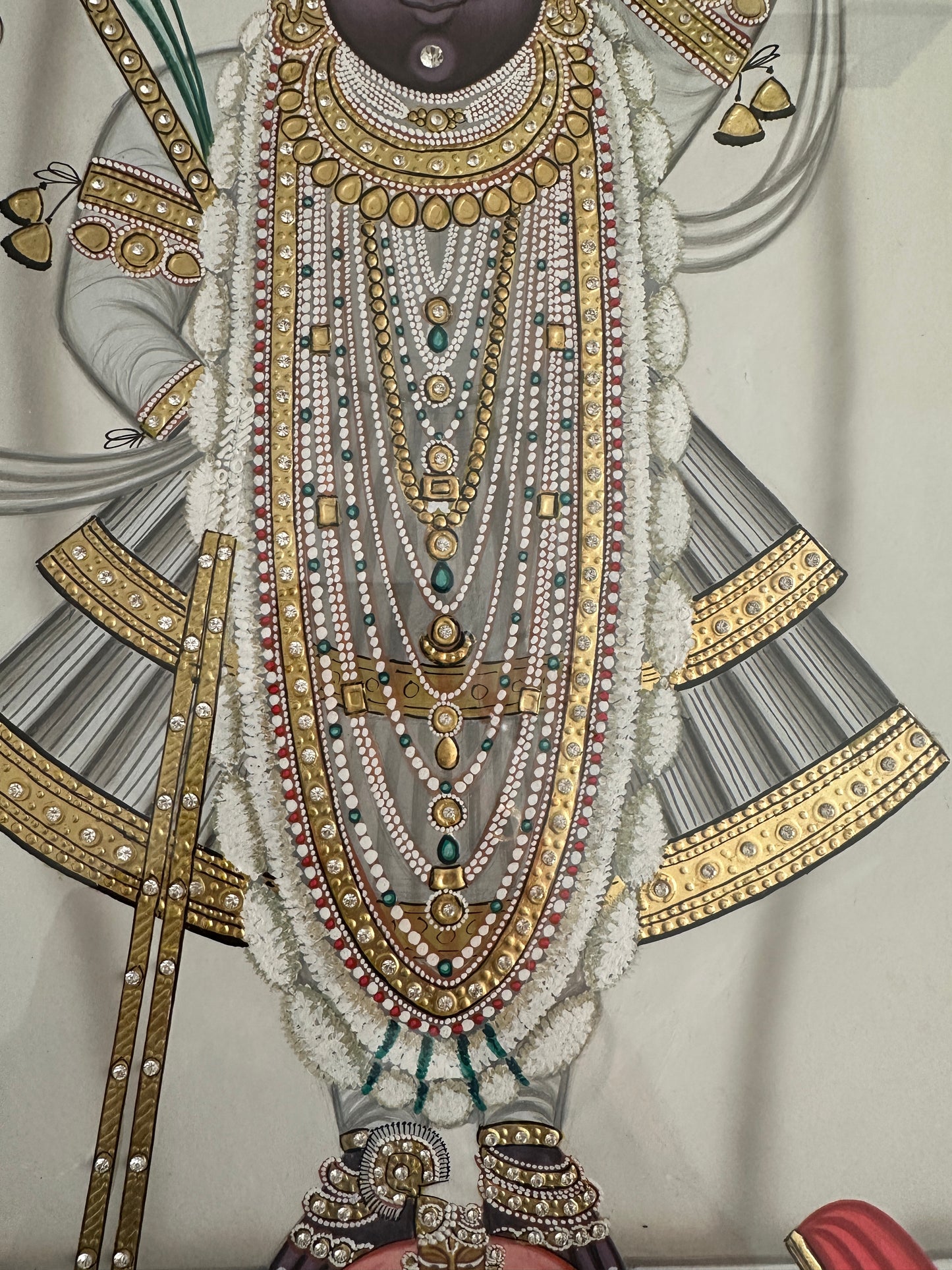 Close-up of Shreenathji artwork with 24kt gold kundan detailing
