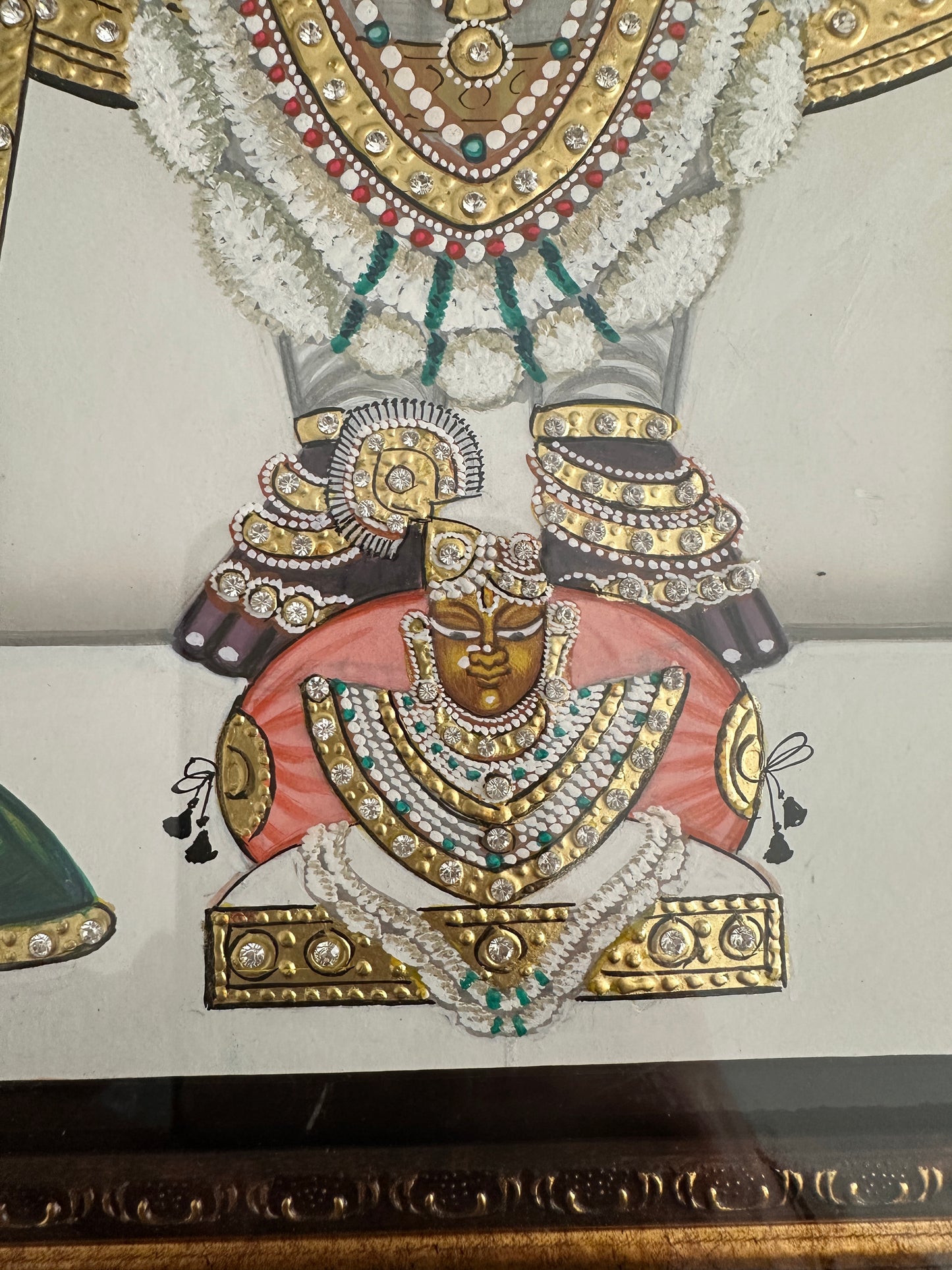 Close-up of Shreenathji artwork with 24kt gold kundan detailing