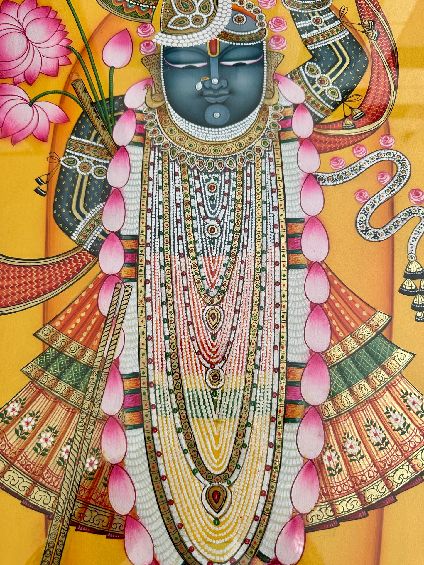 Intricate handpainted detailing in Shreenathji Pichwai artwork