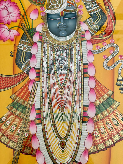 Intricate handpainted detailing in Shreenathji Pichwai artwork
