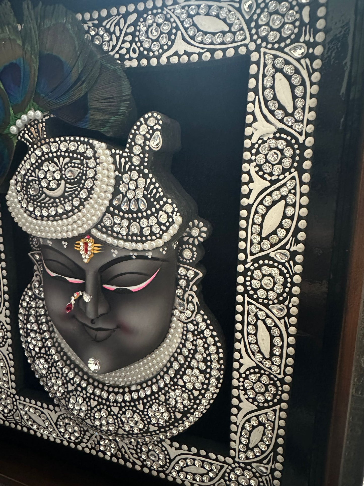 Close-up of Shreenathji Mukh 3D artwork showing handcrafted detailing and texture