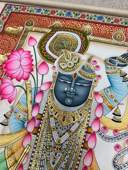 Close-up of Shreenathji Pichwai artwork showing gold leaf detailing and intricate brushwork