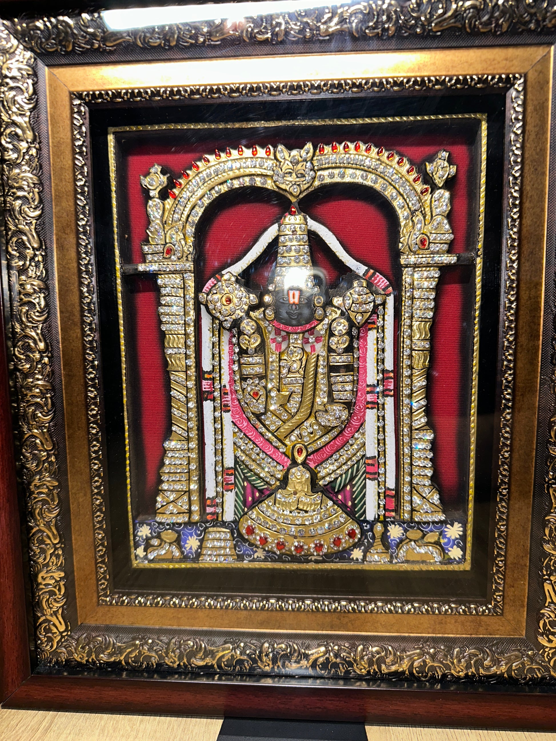 Close-up of Tirupati Balaji 3D artwork showing Swarovski crystal detailing and handpainted finish